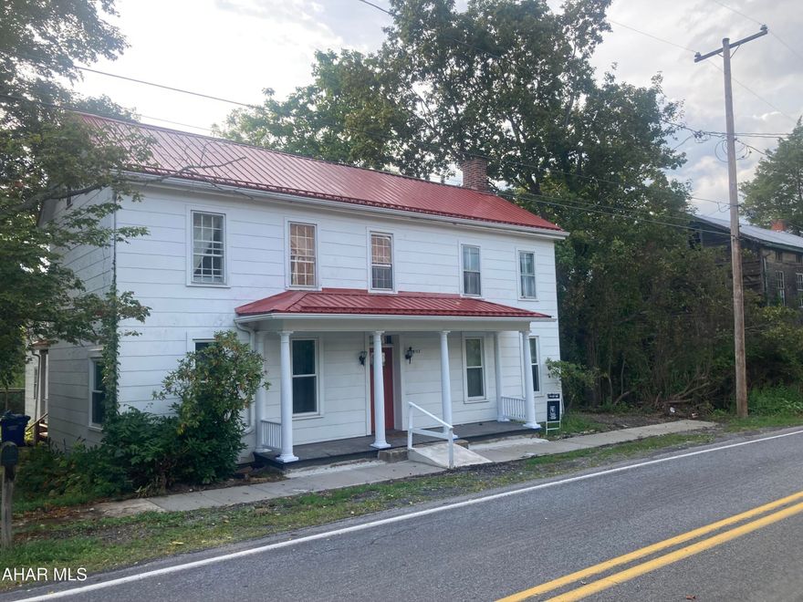 Home was made accessible with Cement ramp to front porch.  1st floor bedroom, with roll in shower.


This beautiful, well maintained 1874 2 story home has so much to offer. As configured, there are 5 bedrooms, (one is pass through) 2 full baths, (one is handicap accessible with a roll in shower) A bonus room behind the ''secret'' door could be a studio, another bedroom, work out room or den/office, and is also accessible from the work shop up a corner stair case. .  The  wonderful workshop, is currently accessed from the small covered porch on the west side of the house, has the  original cooking fireplace with the wrought iron pot arm.  The main kitchen has updated appliances, and is charming.  It can be used as is, or you could reconfigure it to your tastes.  But it currently has a certain country charm to it.   A clean,  dry stone basement has the furnace, oil tanks and plenty of shelves, which could be used for supplies or even storage for canning 

The main floor has the living room, dining room, kitchen, the accessible bedroom and bath, laundry room, and several access doors to out side.  Currently the seller is completing the work on the two porches for safety. A fourth exit is available in the Workshop, but will need steps fitted out side. Upstairs bedrooms are ample and well lit, one bedroom has en suite access to the upstairs bathroom.  There are closets in each bedroom, and wonderful built ins in the upstairs bath and the downstairs bedroom.  

The windows in the home are a combination of newer and more original single pane (upstairs) The new metal roof was put in in 2025 and a new sidewalk has just been completed. Seller is motivated, so let's schedule a private showing to make your dreams come true...