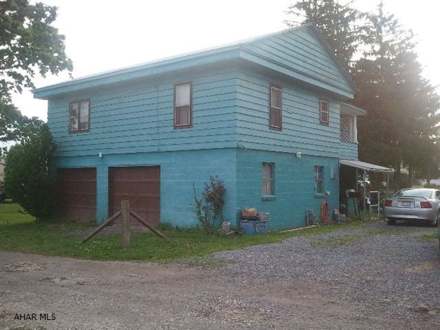 Raised ranch home in Bellwood.  Huge 1/2 acre lot (124'x180'), covered porch, 2 1/2 car garage, above ground pool w/equipment, shed.  New rolled roof, new water line, and new hw tank, new Kitchen & hallway floor covering, and new 100 amp. electric box.  1-Year home warranty included.