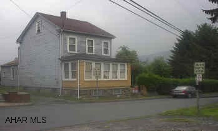 Zoned Residential/Commercial.  House needs work.  74 ft of frontage on Pleasant Valley Blvd.  House could be torn down for Great Commercial Potential!