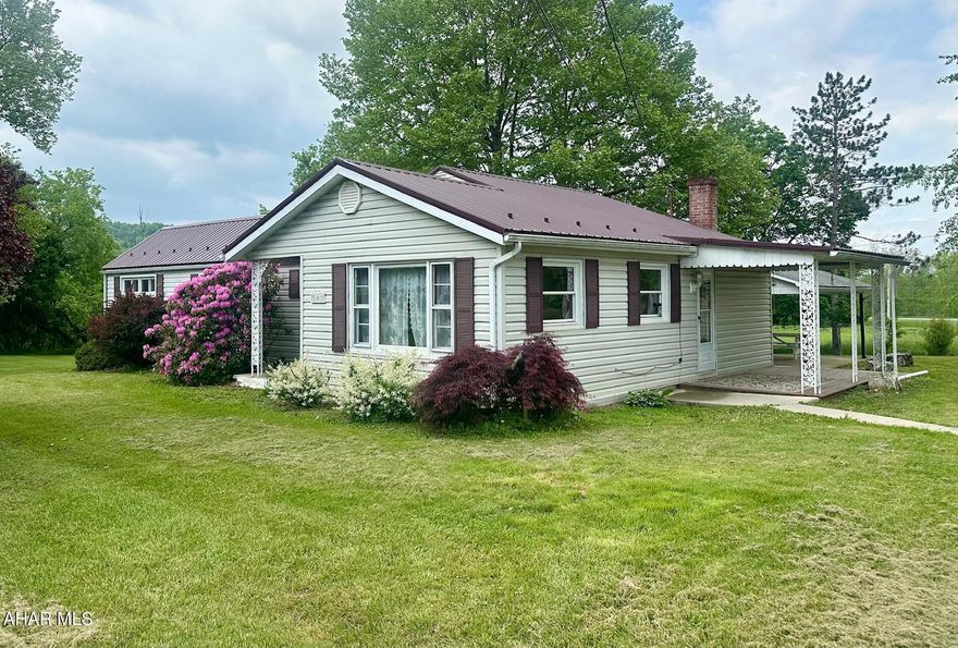 This inviting 3-bedroom, 1-bath ranch home offers a peaceful rural setting, sitting on just under 1 acre of land. The home features a spacious, 1429 sqft of living space with a cozy living room, and the convenience of main-floor laundry. The kitchen comes fully equipped with all appliances included.  Step outside to enjoy the covered back patio, perfect for outdoor dining or relaxing, and a side porch ideal for a morning cup of coffee. The expansive yard offers plenty of space for gardening, recreation, or future projects.In addition to the home, you'll find a 3-bay commercial garage on the property. While the garage could use some TLC, it has incredible potential for storage, a workshop, or more. Easy access to local amenities, I99, PA Turnpike and more.   Schedule your showing today to see the potential this home and property have to offer!