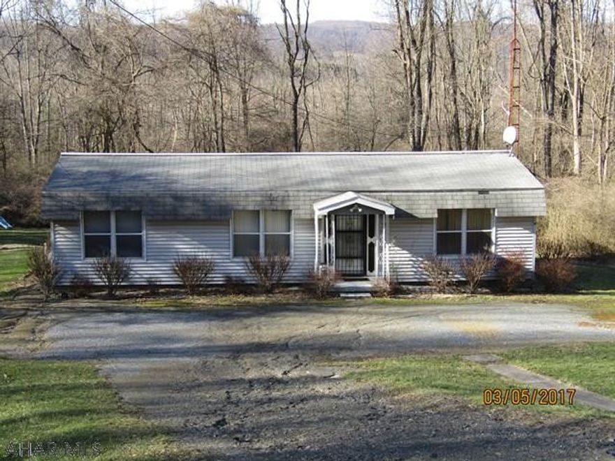 Cute 3 bedroom 1 bath Manufactured Home (Double wide) with large covered rear deck and off street parking. Lots of possibilities with this property nestled on Reservoir Road in the Hollidaysburg school district on 1/3 acre. With a little TLC you can make this house your home! Call now to check out this listing!