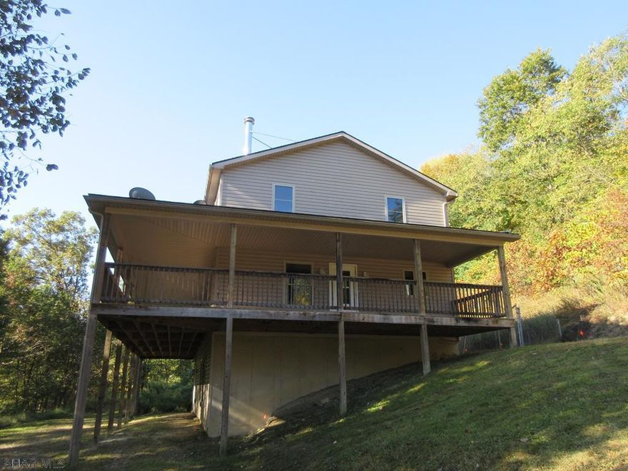 Large 2 story vinyl home on 2.82 acres. Recent build with updated features throughout. Open floor plan with a beautiful living room with hardwood floors and fireplace with adjoining oak kitchen with dining peninsula. 4 large bedrooms and 2 baths include a master suite with a hot tub and a stand-up shower. Large wrap around porch offers loads of views and secluded privacy. It needs some work, but could be a real dream home. Property sold AS-IS. Seller will make no repairs. Offers must be submitted through HUD-approved broker. Buyer pays both transfer taxes. Exclusive Agency. Equal Housing Opportunity. Marketed by Olympus AMS. www.olympusams-re.com. www.HUDHomestore.com