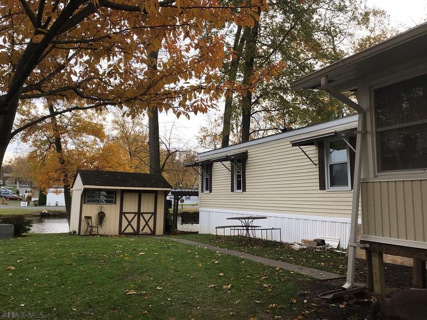 You will be mesmerized the moment you enter this charming 2 bedroom home.  Located in Friendship Village, this trailer will entice you to sit and enjoy the waterfront view and peaceful setting.  This home offers many updates including a newly renovated dining room/sunroom located just off the living room and kitchen.  The home would make a wonderful retirement home or summer retreat.  Enjoy the privileges that come from living in this friendly village that include pool and recreation facilities and so much more.  Restrictions do apply to ensure a quality environment.