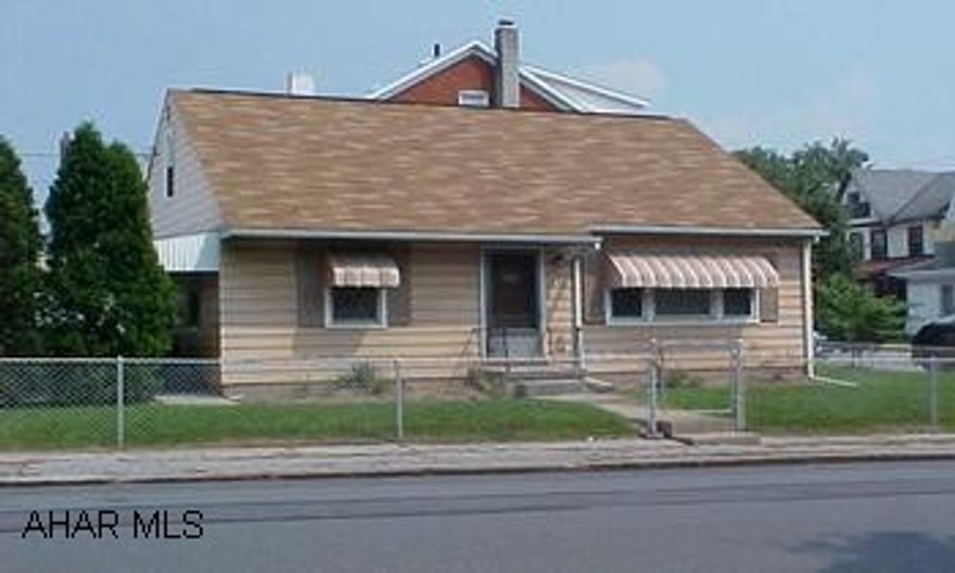 Adorable Cape Cod in Juniata.  New Roof "03.  New Tilt-in windows. Cute as a button - won't last!!  Double lot - well maintained.  Hardwood under carpet.  Range, Refrigerator & window unit AC stay.  Washer & Dryer can be purchased separately.