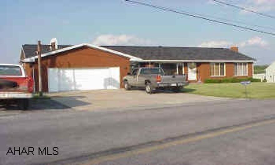 Beautiful brick country rancher with great view.  Finished basement with franklin stove.  Many added features.