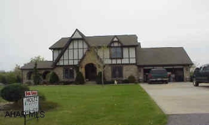 4 BR, 2  bath executive home on landscaped 1 acre lot. 2 jacuzzis, 2 car attached garage and 3 car detached garage. exterior is brick, stucco, and stone.