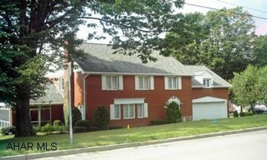 2 story brick w/2 car attached garage. Beautiful corner lot in quiet neighborhood of Cresson Extremely well maintained home with 3 BR., 3 bath, very large rooms, wood fireplace, sunporch, finished basement w/wetbar, are only a few features of this home.