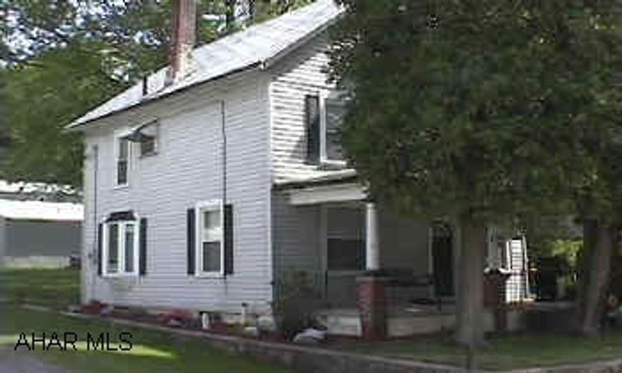 Large living room, dining room area.  Hardwood and carpet.  Modern kitchen.  2 large bedrooms on the second floor.  2 finished rooms on the 3rd floor.