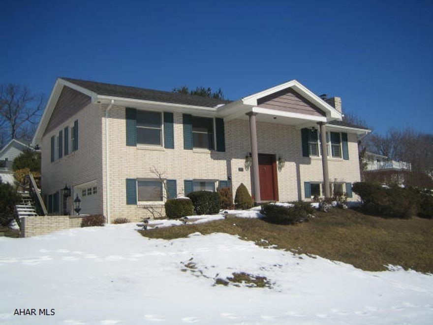 College Heights charmer near PSU Altoona. Brick split entry recently updated with new carpeting and fresh paint throughout. Large living room, formal dining room, eat-in kitchen plus relaxing screened porch off dining room. Beautifully finished basement features family room with brick wood burning fireplace and custom built-ins. 2 large semi-finished rooms plus bath in basement that could easily make this a 5 bedroom home and/or possible separate living quarters. 1 car integral garage w/ opener, central air and storage shed. Move right in!