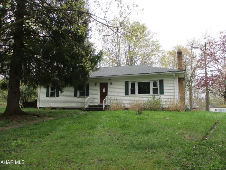 This is a property in Ligonier Valley School District located in St Clair Township.  Nice 2.03 acre lot with detached garage and private driveway.The property is a one story home that features 3 bedrooms, a living room with fireplace, dining room, kitchen and full bath. The basement is unfinished with 2 sump pumps. The panel box is on the exterior and only the 2 sump pumps are hooked up to electric. The house needs rewired, plumbing and heating repairs. This is a great opportunity  for a 1 story home on a nice lot in the school district.