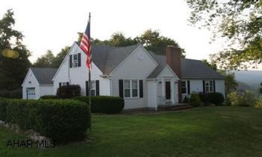 Charming Cape Cod overlooking the town of Everett; situated on 2.29 acres. Charming Cape Cod overlooking the town of Everett; situated on 2.29 acres. 2BR on main floor, 2 BR and bonus room upstairs, 2 full baths. Eat-in kitchen w/pantry; formal dining room w/ fireplace and built-in hutch; spacious living room with wood beams and shutters; built-in bookcase. Family room with kitchenette in basement. 1 car attached and 1 car integral garages. 1 car detached garage used as workshop with heat. Out building for storage. Spacious/  landscaped yard with flowers, brick sidewalk, large trees. Also oil back-up and generator.