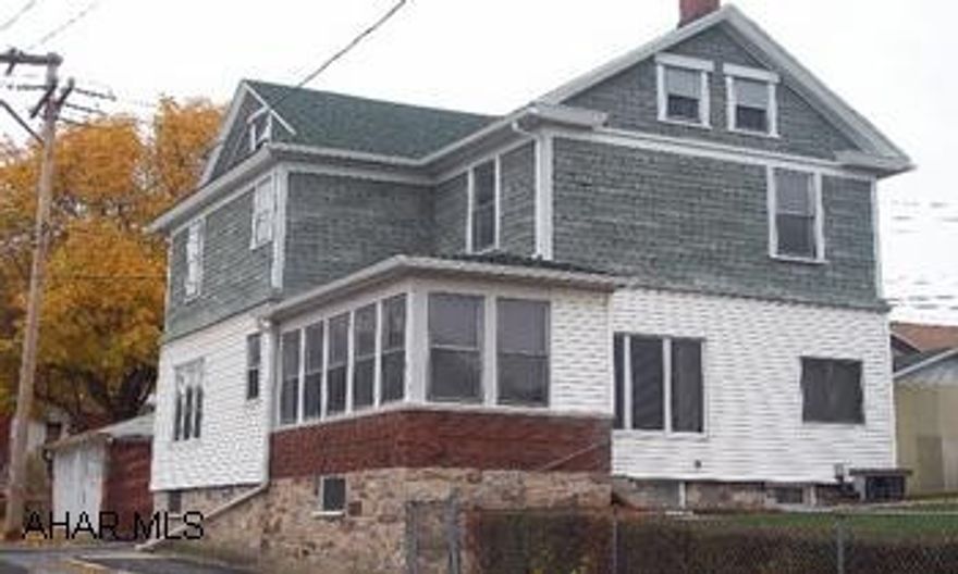 This 3 BR home has original woodwork, french doors and cozy sunroom.  The kitchen has been updated and includes appliances.  Great fenced corner lot. Move right in!  This 3BR home has original woodwork throughout, french doors and a cozy sunroom.  The kitchen has been updated and includes appliances.  Central air, newer furnace and roof.  Lovely corner lot.  Alot to offer for the price!