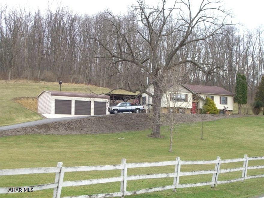 This is a great 5 bedroom 3 bath home setting on 2 acres bordering several hundred acres of wooded Penn State University land.  There is a screened porch with a hot tub, a covered patio and a detached three bay garage for your cars and toys. If you enjoy privacy and watching wildlife while being a short distance from several communities, this home is for you. You will be located between Huntingdon and State College, only 13 miles from Juniata College and 16 miles from Penn State University.