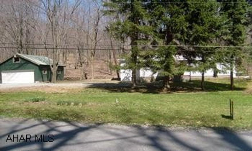 Newly updated interior with the following improvements: New drywall, carpeting, bathroom, plumbing, electrical, water and sewer lines. Singlewide house on 0.85 acre of land, stream in the back yard, also offers a 2 car detached garage.