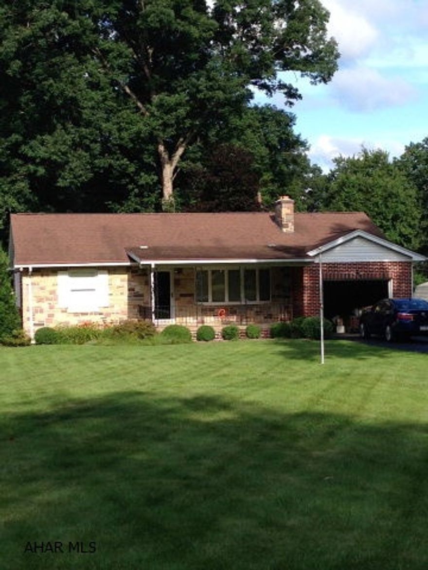 Bellwood Schools! Immaculately maintained brick rancher on big 80x206 lot! Hardwood floors in spotless condition throughout. 3 nicely sized BR's. 2 Full baths. Tons of extra space in the finished basement. Utility room w/ cedar closets, central air, workshop, fully functional summer kitchen, huge family room and TONS of storage. Beautifully landscaped lot, updated mechanics, integral garage, stone fireplace. One owner in this beautiful home, is the reason it has been so carefully taken care of. Solid, Sturdy, and well crafted.