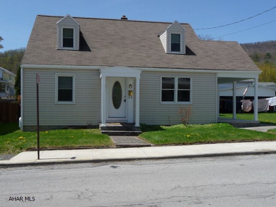 Nice 1 1/2 story vinyl sided home on level lot. Large remodeled eat in kitchen with ceramic tile floor. Beautiful hardwood floors throughout rest of the home. Concrete block, one car detached garage with attached carport. Covered stoop and side patio add to the charm.