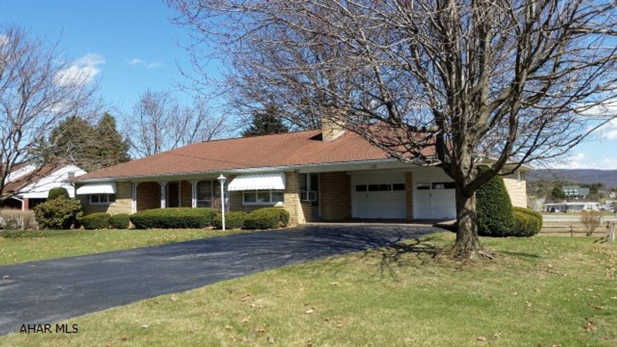 Great 2-bedroom brick rancher with 2 fireplaces, hardwood floors, deck and attached garage. #J-282