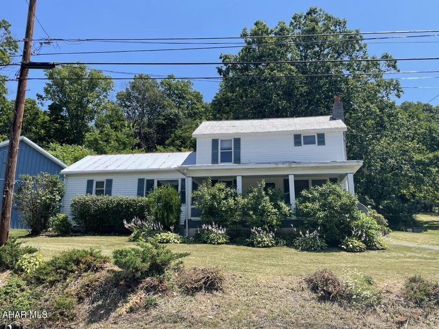 This lovely home is nestled along state game lands on 1.3 acres with some large, mature trees.  The home has been very well maintained and has a main floor bedroom and main floor large laundry room, and 2 additional bedrooms and a spacious loft upstairs.  Eat in kitchen has beautiful hardwood floors and a large window overlooking the flowerbeds, and the cabinets are uniquely made from knotty pecan.  30 x 40 pole building with 3 bays, concrete flooring and it's own electrical service panel.  With its proximity to state game lands, rails to trails and being just 20 minutes from Raystown lake, this is an outdoor lover's dream! This property has so much to offer.