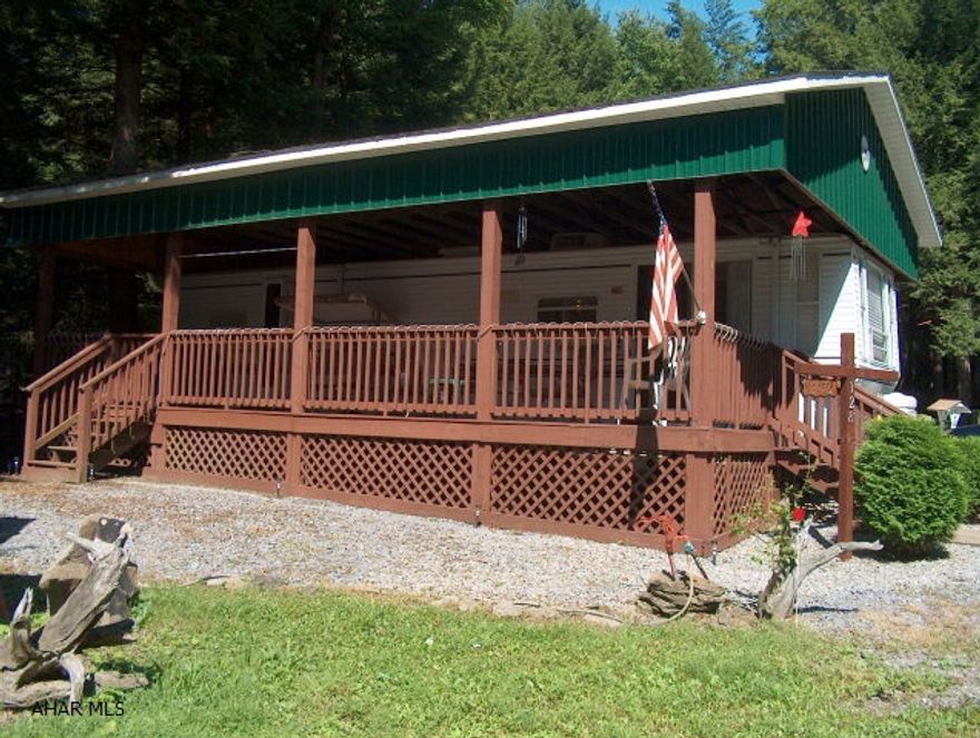 Fabulous, furnished 2001 Keystone Sprinte camper w/full covered deck & shed Large rooms Second lot for camping or parking.