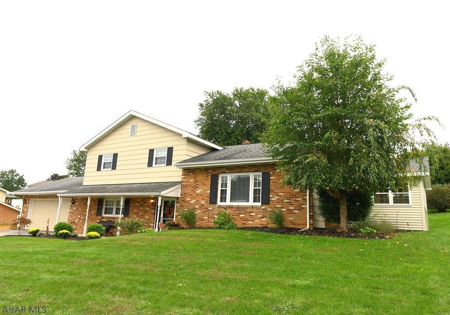 Beautifully updated 3 bedroom, 2.5 bathroom multilevel home. Make this move-in ready home yours today. This home has an open floor plan with a newly updated kitchen, which includes modern gray stainless appliances, granite counters, and a large island. All this is open to the living area with wood floors and a stone faced gas fireplace. There is a great sun room that is also open to the main floor. The upper level has 3 bedrooms and 2 newly updated baths. The lower level has a large family room with recessed lights, a laundry room, and 1/2 bath. Keep cool in the summer months with the new central AC system and warm in the cooler months with the hot water heat. 2 car garage all in a cul-de-sac neighborhood in the Hollidaysburg School District.