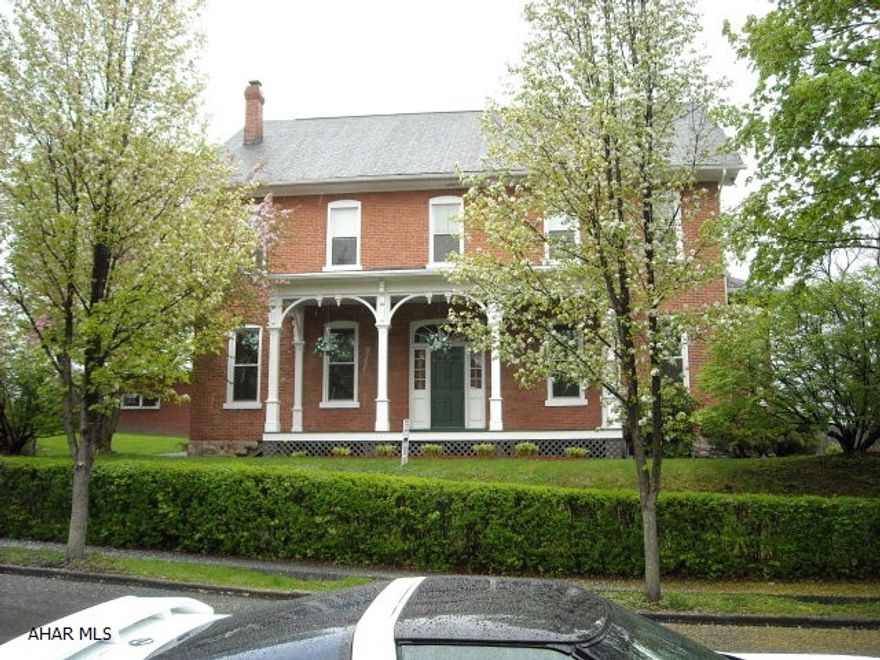 Reduced! Grand Estate / Farmhouse with numerous updates! Exceptional room sizes and ceiling heights. Used as 4 BR, but can expand to 7BR. All brick with a brick two-car garage with a new rubber roof. New cement patio and front porch, 200 amp electric, one of the most advanced heating and hot water systems available (state-of-the-art). Gas fireplace inside and stone fireplace outside. 1st floor laundry room, 2 staircases, side porch to kitchen, fabulous entrance foyer. Unique & Rare! Home is approximately 5076 Square Foot with a basement. Off-street parking up the driveway and a fairly level yard with various beautiful plantings.  Penn Lincoln Elementary.  The best home warranty we offer paid by the Seller! Motivated Sellers!  Confirm appointments - Security System.