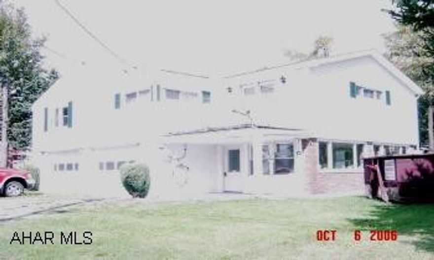 Well maintained - one owner raised ranch. 2 car garage, 3 season porch, 2 sheds, nice lot. Extra bonus room, ice melt system for roof & back up generator system.