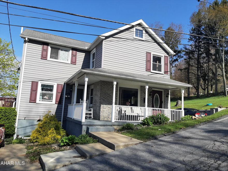 Welcome to this peaceful location in Gallitzin. This property sits on almost an acre with expansive views from the deck. The outdoor spaces also include a firepit area, private drive with parking, massive shed, and plenty of yard space. It doesn't even feel like you are ''in town''. This home is updated throughout and offers radiant floor heat on the main and second floors. The kitchen offers two walkouts, one to the deck and one to the front parking area, plenty of counter space, breakfast bar, and room for a dining table. The living room is spacious with plenty of natural light. Upstairs you will find three nice sized bedrooms and a full bath. This home is very well maintained and is ready for its new owners