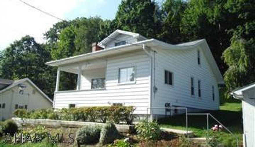 City Limits Living! So much more to this well kept home than meets the eye sitting on .32 acre lot featuring a spacious 2 car finished garage. Walk into the side door and into a clean kitchen featuring ample counter space and a breakfast nook. Walk out to the sunroom for some nice weather protected outdoor seating. A formal dining room opens up to the living room and an additional TV room that could double as a 5th bedroom. A full bath off of the main hallway that features a large closet and enter two bedrooms. Head up to the second floor and find two more bedrooms and another bath. A full basement features solid concrete floors, newer water heater and furnace, and plenty of storage space. Do NOT MISS this charming city limits living opportunity!