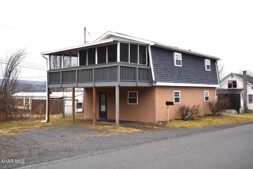 This cute home has been updated and features two very large bedrooms, one of which has a door to a huge screened porch which offers great additional space in warm weather.   First floor half bath and nicely updated full bath on second floor.   Handy carport to keep the snow off.   If you're looking for affordable and low maintenance, this one is for you.