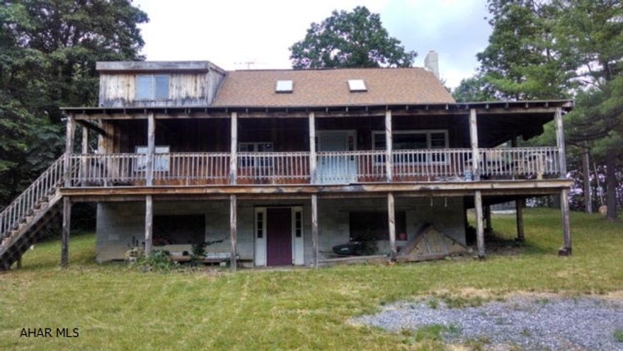 Four bedroom, two bath rustic cabin with cathedral ceilings, wrap around deck, located in the woods. Close to State Game Lands and Rt 70, PA Turnpike and just off Rt 30.