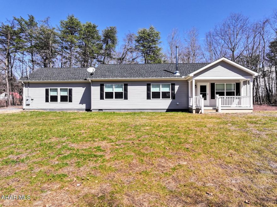 Welcome to this beautiful 3-bedroom, 2-bath ranch home built in 2023, nestled in a private setting. Designed with an open-concept layout and a desirable split floor plan, this home offers both comfort and privacy. The kitchen is a showstopper—featuring stainless steel appliances, marble countertops, and ample cabinet space. The spacious master suite is tucked away with a stunning tiled shower in the en suite bath. Two additional bedrooms are located on the opposite side of the home, along with a modern full bath. Enjoy energy-efficient windows, central air, and the warmth of a wood-burning stove. An attached two-car garage adds convenience to this thoughtfully designed home.