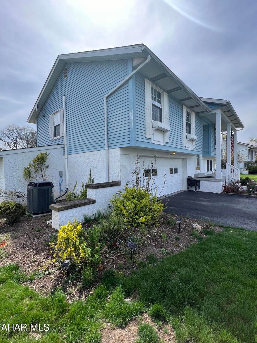 At home in Hollidaysburg! This gorgeous home is move-in ready! With Corian countertops and adjoining dining room, spacious main floor living room, and 3 large bedrooms all on new flooring! The 2.5 baths include a Master suite w/ walk-in shower. Enjoy the finished basement with a family room featuring a wood burner, 1/2 bath, and laundry room. From there you can walk out to a relaxing screened in patio, enjoy the large rear wood deck, and park your yard tools in the attached shed. Central air, hardwood floors, insulated glass windows, 2 car garage, attic storage w/ pull down stairs; all on a level lot! Conveniently; this home is close to schools, YMCA, shopping, I99 and more! Schedule a tour today before this one is gone!