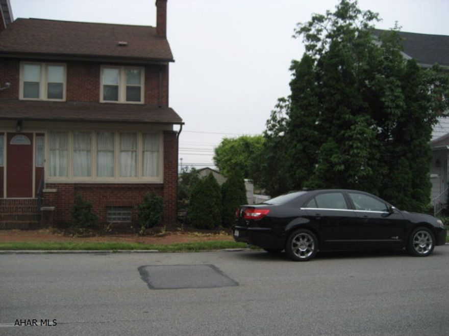 move in  ready 2.5 Story brick 3 bedroom home beautiful hardwood floors living room with fireplace. heated sun room, modern kitchen, updated bathroom, large master bedroom, 3rd floor is finished and heated could be a 4th bedroom. 100 X 120 lot with patio, and storage building