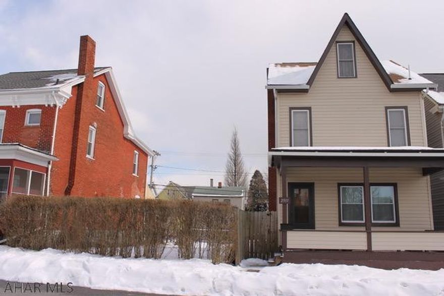 Spacious 2-3 bedroom home.  Attic is heated could be 3rd bedroom.  Nothing to do to this home but move in!  Large flat fenced yard with detached garage that offer tons of storage.