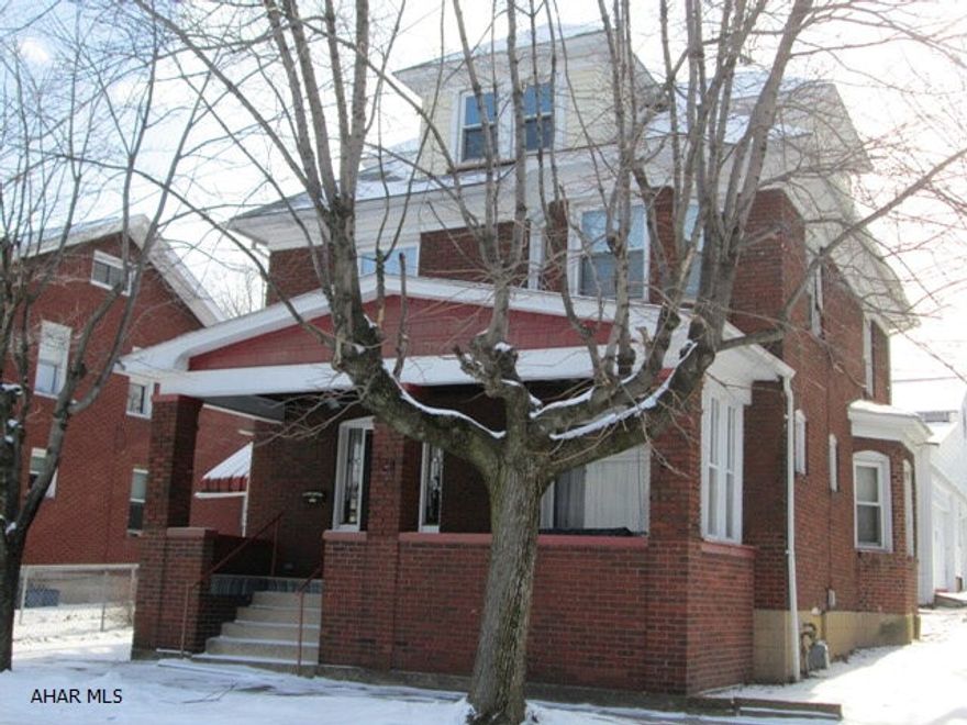 All brick duplex with additional income possibilities with the 4 car garage!  Second floor is ready to rent, first floor needs some TLC.  Sale includes 2 refrigerators, 2 ranges, 1 washer, and 1 dryer.