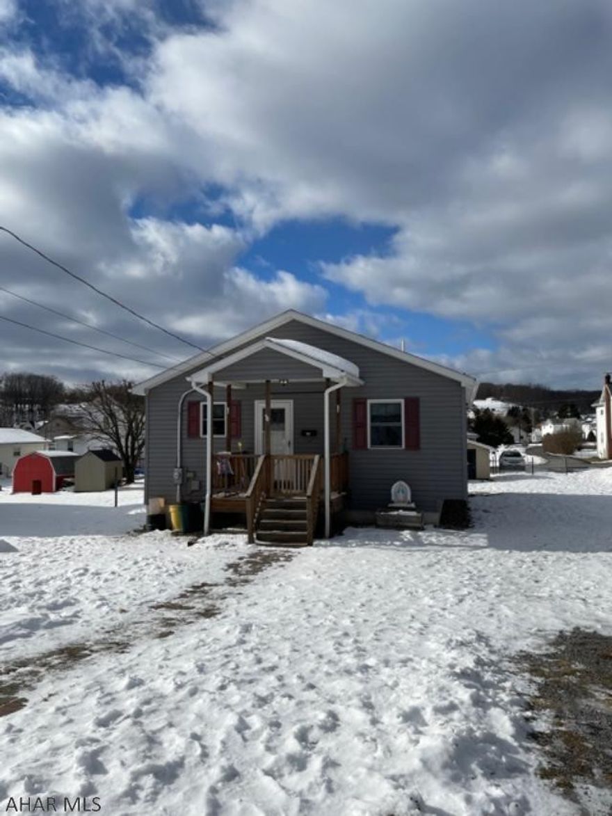 Much larger than it looks, this extremely well maintained home in Lilly was built in 2007 on the original foundation that had a new coat of concrete applied.  Sellers have made many renovations, removed the wall between living room/kitchen to open the space.  Large island great for meal prep and dining, plenty of cabinets for storage.  Three spacious bedrooms one full bath, master bedroom has half bath and laundry.  The basement has a family room currently being used as a bedroom, and a wood shop that could be converted back into another family living space.  Pellet stove/furnace helps saving on heating costs through the winter, $450 a year for 2 tons pellets.  One floor living.  Will qualify for FHA, VA and USDA.  Call today!