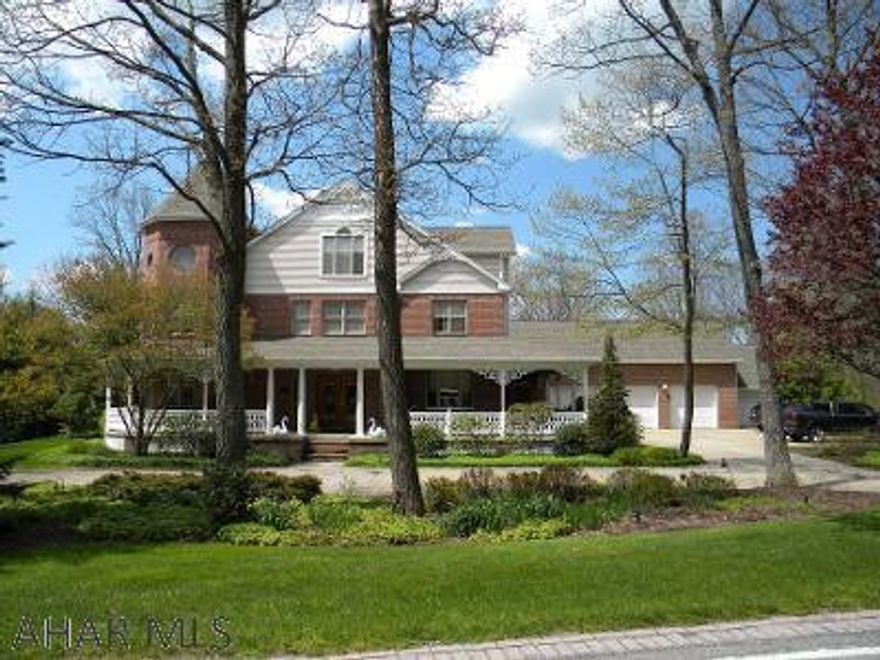 NOW $699,999 for Stunning Stonehedge beauty! Victorian Era Architecture 3 story home.  Don't be fooled by the square footage (Total 5 BR, 6.5 BA)    - this home is still very inviting and "homey".  A must see!  So many amenities.  Spacious kitchen w/Butler's Pantry - open to large family room.  Step out into the Inviting Sunroom to watch the deer.  3rd floor offers BR, (could be 2) Bath, office, and STILL storage.  Abundance of closets.   Indoor heated Salt Water pool, large pool area for entertaining w/Wet Bar, heated floors, the roof opens.  2 patios to entertain w/lots of family and friends. 4 C Garage, 20' x 15' Shed, Extra 1.23 AC lot available - buyer for home has first right to purchase.  Maintenance free "composite"  porch.   Call listing agent today and schedule a private tour.