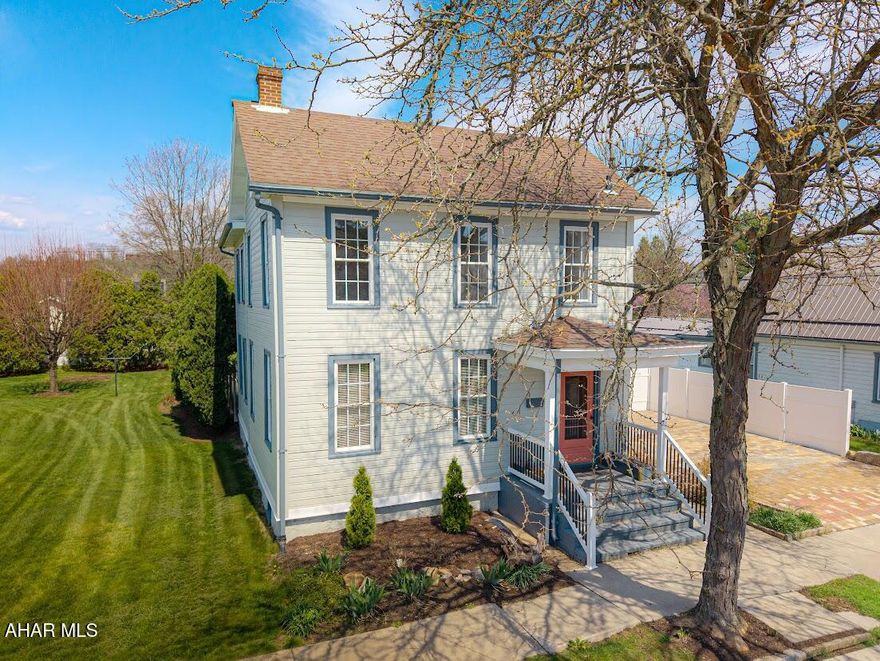 A charming nicely updated 3 bedroom 2 bath home has everything you need!!  Entering the foyer, the elegance and charm of the home takes over showing the solid walnut massive staircase. The spacious living room and dining room has the original walnut built-in arch way adding shelving for for books etc. giving a nice separation to each room.  The galley kitchen has all LG new stainless steel appliances and cabinetry  and recess lighting. Eye catching handmade solid wood countertops. The back door is glass adding additional light which goes out onto the back covered porch leading to the unique patio made of brick pavers. The white vinyl privacy fence adds to landscaping with the spacious backyard for all your enjoyment.  The 2nd floor features a stackable washer/dryer and spacious pinewood closet, off the master bedroom. Master bath has   large shower and modern glass door, lighted touch mirror over vanity.  The spacious 2nd bath offers a tub and storage and nice access for the 2 bedrooms.  The off street parking is a bonus showing off the 2 car parking spaces with its unique brick pavers giving the outside that wow !!  Centrally located and walking distance to town and schools!!