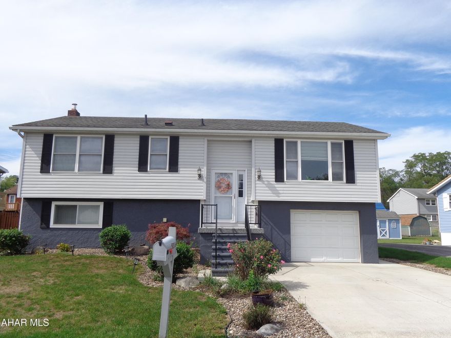 This house has a sunny disposition!  
Huge Family Room in basement, fenced in level backyard, central air, 1 car garage ,  all appliances & washer/dryer included , deck,  desirable neighborhood all of these things  makes this home hard to pass up.