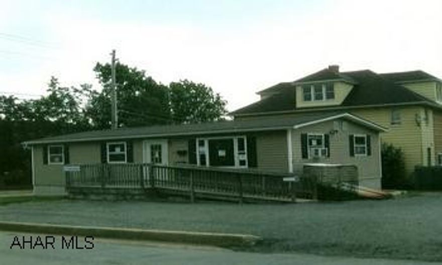 Doublewide, could be an office, or great rental for savy investors. New windows installed by Oct., new carpeting, full basement with heat.