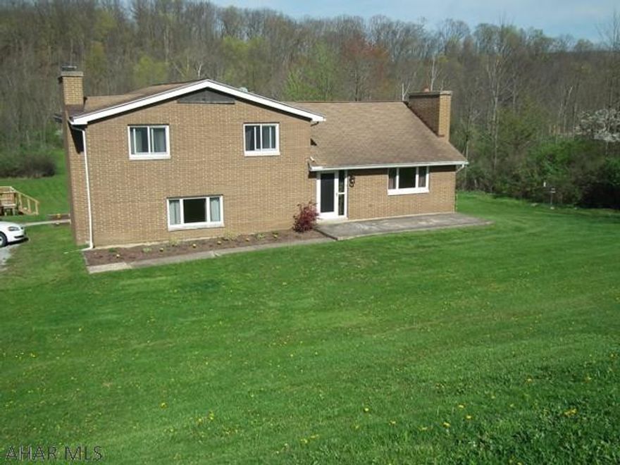 Picnic anyone? Just in time for summer! This all brick home sits on 2.88 acres with above ground pool and patio to enjoy those summer days and nights. Great yard for all family and friend activities. Wooded area great for exploring. Home has 4 bedrooms, 2 baths, large kitchen, large living room with fireplace (stone wall). Lower level has family room, office and bath. Seller has contract to replace roof.