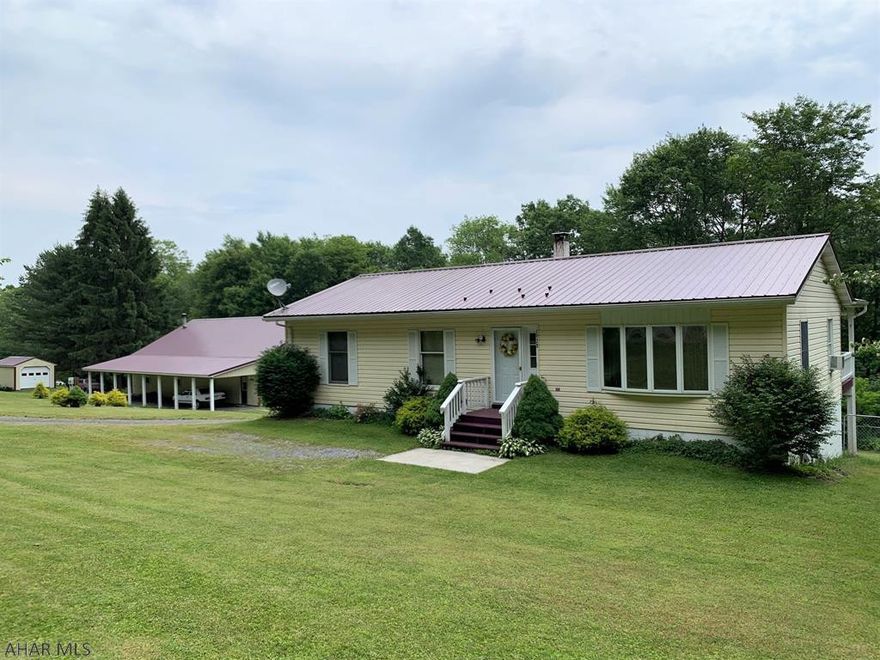 Well maintained ranch home resting on 2.8 acres w/ large detached garage!! The home features 3-bedrooms, kitchen w/ oak cabinetry and stainless appliances, dining room, and a full bath on the main level. Partially finished basement w/ high ceilings, walk-out to exterior, laundry room, a full bath, and 1-car integral garage. Natural gas hot water heat, updated gas water heater, 200-amp electric, private well, and private sewer. Large rear covered deck to entertain or enjoy wooded views. 40' x 60' garage w/ attached 12' x 60' carport. No expense spared in this garage, fully insulated and finished, water, conduit air-compressor lines, heated and central air-conditioning. Convenient location close to Route 220, Omni Bedford Springs Resort and MD.