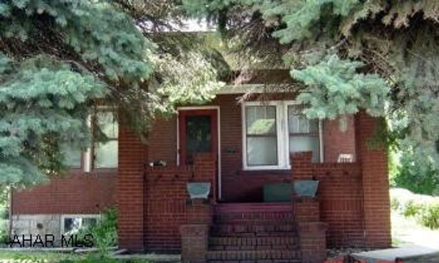 Cute brick 1 story home. Large lot. 1 car garage. Window treatments stay.