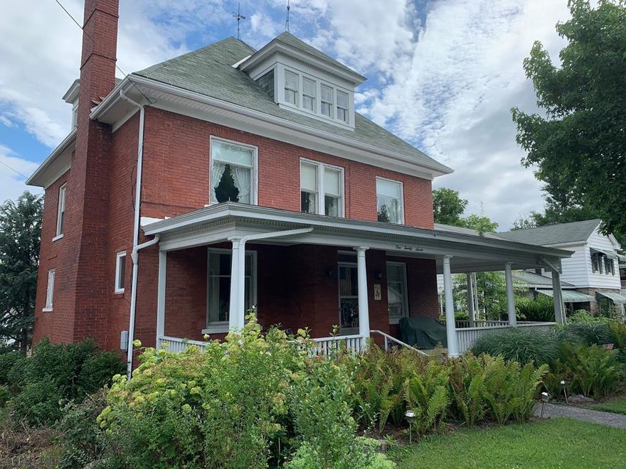 Front porch memories are yours to be made at 127 East John Street!!! Beautiful, brick home 6 large bedrooms, 2 full bath, 2 half bath, and lots more! Beautiful hardwood floors throughout home, stunning archways, tons of windows for natural light. Natural gas fireplace in the living room.  2 sunporches one located off the kitchen and the other located on second floor to make your own!  One cedar lined walk in closet on second floor.  New gas furnace 2019.  2 car detached garage and off-street parking.  One block from Bedford's downtown amenities!!   Walking distance to Bedford Bison Friday night football games!! Close to PA turnpike for easy comutes.  Make this your forever Bedford Home Sweet Home!!
