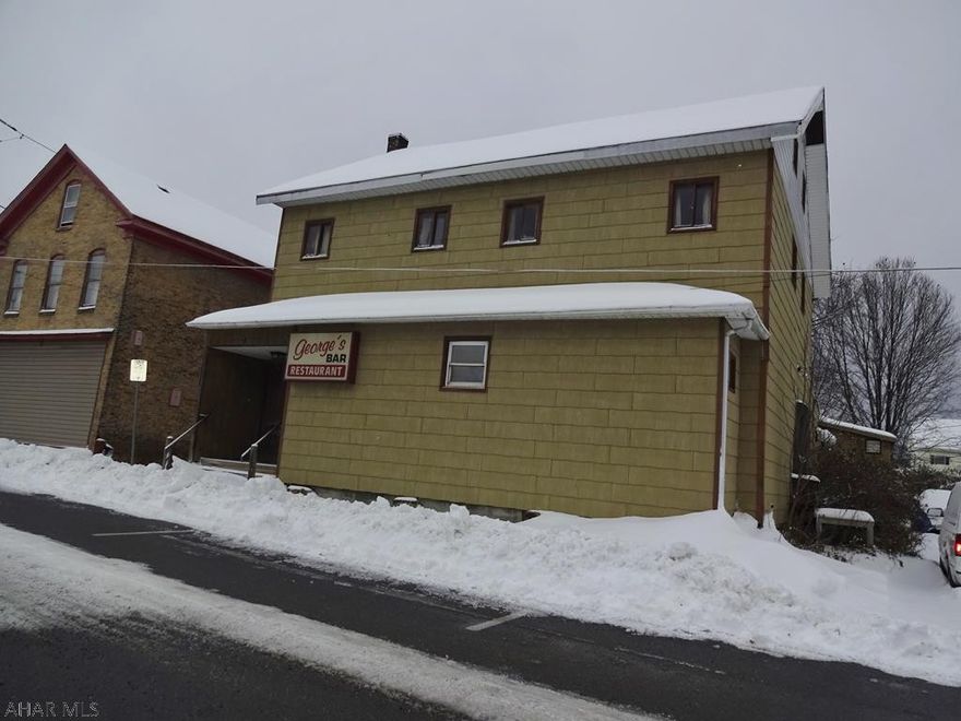 This property business operated as George's Bar. Sale includes building -first floor bar/restaurant. 2nd floor rental unit- currently unoccupied