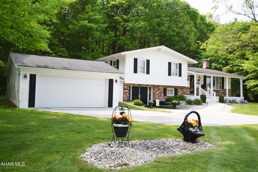 Absolutely beautiful and meticulously maintained multi-level three style home with many upgraded features.   Cherry kitchen with granite countertops and ceramic tile floor.   Living room with bay window.  Formal dining room with French doors to patio.  Newer carpeting.  Top level features three bedrooms and one full remodeled bath.  Lower level has spacious family room with gas fireplace and 3/4 bath.   From this level is an enclosed breezeway to the garage.   The outdoor living area was made for entertaining with  private yard that backs up to the woods, large paver patio with  natural gas firepit, and gazebo.   Home is extremely energy efficient with low utility bills.