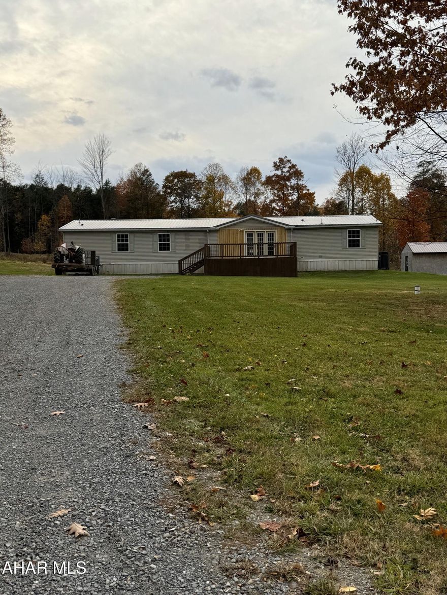 Remodeled double wide on 5.6 acres of level land includes a 30x40 horse barn with 8 stalls, loft hay storage and loafing area. Additional sheds and fenced in pasture. The home features updated living room with vaulted ceiling, Updated kitchen with pantry and center island, 4 bedrooms and 1.75 baths. Laundry area and family room with fireplace.  Nice country setting and very nice move in ready home.