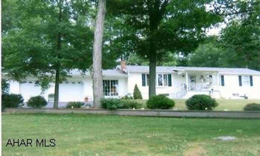 Lovely view with this well kept newly vinyled Ranch home with lots of space. Immaculate ranch home with a spectacular view. Large inviting sunroom with heat, foyer with Bruce hardwood flooring, birch cabinets and eat-at counter in kitchen. Basement has large family room with woodstove and summer kitchen. Lovely trees and landscaping, covered front porch with stamped concrete floor, convenient shed in back.