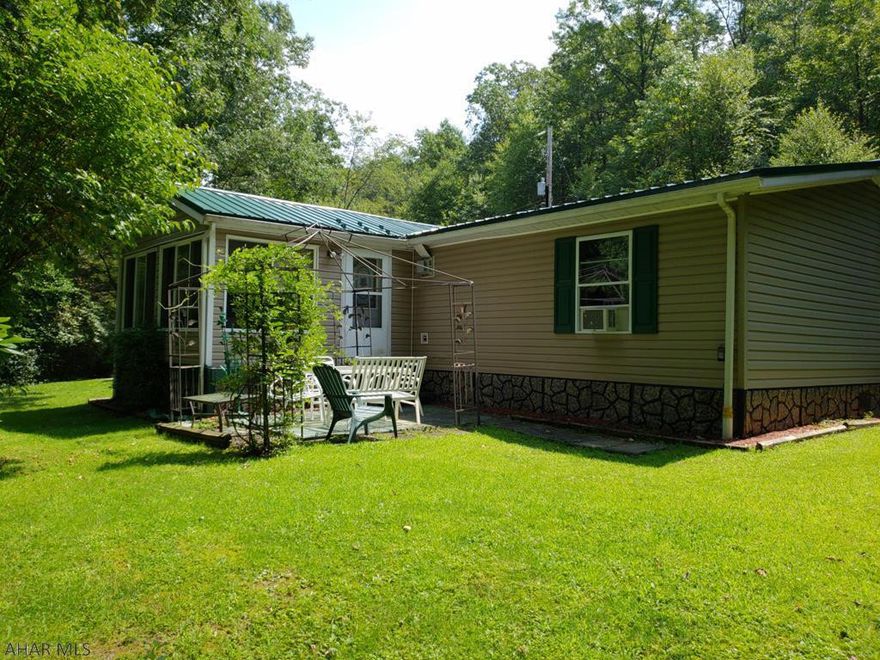 See 3D Tour coming soon! Situated on 31.02 acres of pristine land, you will find this well maintained, 3 bedroom, 2 bath home that has something to offer for everyone.  The cook will enjoy the well-appointed kitchen with new appliances which are included in the sale.  The hiker will find complete enjoyment after a hike through the woods.  Complete with 2 outbuildings, this property also includes a hobbyist building with pool table room and enough space to enjoy the projects you love.  The master bathroom features a garden tub, perfect for relaxing after a long day on the trails or in the office.  Features include a Randon reduction system, new sewer pump, new stovetop, new oven, security system, & house generator, This is in move in ready condition.  Finally, this property is Clean & Green