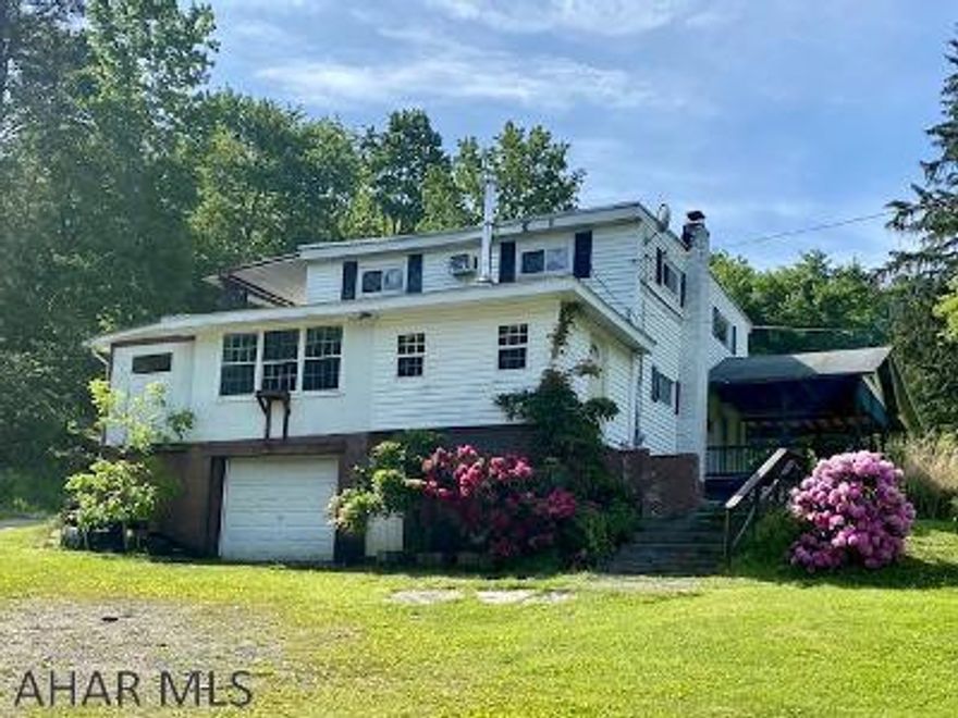 22.52 Acres in Logan Township!  Opportunity awaits you! Be creative! Needs TLC! This is a multi unit that can be renovated to its original single family dwelling. Here is an opportunity to purchase a 22 acre property in Altoona. 2 units - 1st floor - kitchen, dining, living room, 1 bedroom, full bath, laundry room, bonus room. 2nd floor - living room with dining area, kitchen, 1 bedroom, 1 1/2 bath.  All appliances included.  Single integral garage and carport. Selling property "as is".